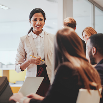 Woman at job fair talking to candidates for new jobs