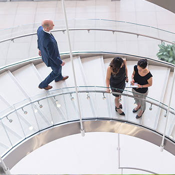 People on staircase in their third party administrator's office building