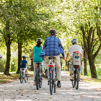 A healthy family taking a bike ride together